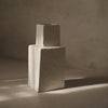 Textured beige vase with minimalistic geometric shapes, showcasing a subtle, earthy color palette.