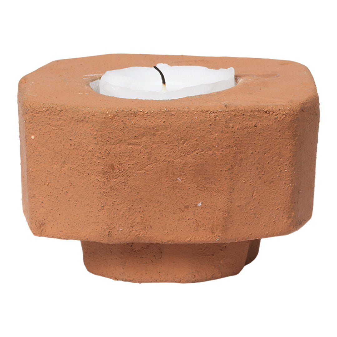 Rustic terracotta candle holder with a smooth matte finish and a minimalist design. Ideal for earthy decor styles.