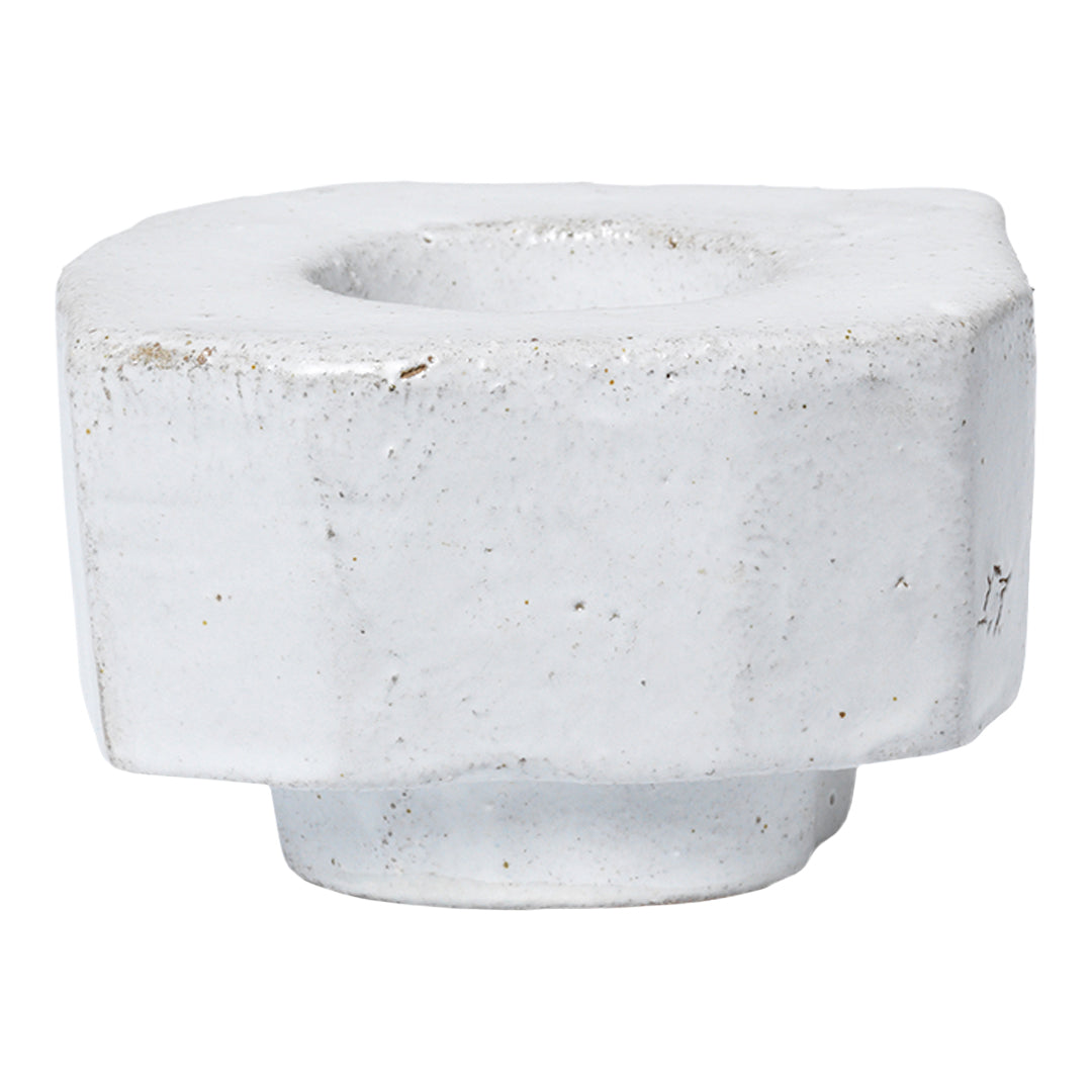 White textured candle holder with a geometric design and subtle speckles, perfect for modern decor.