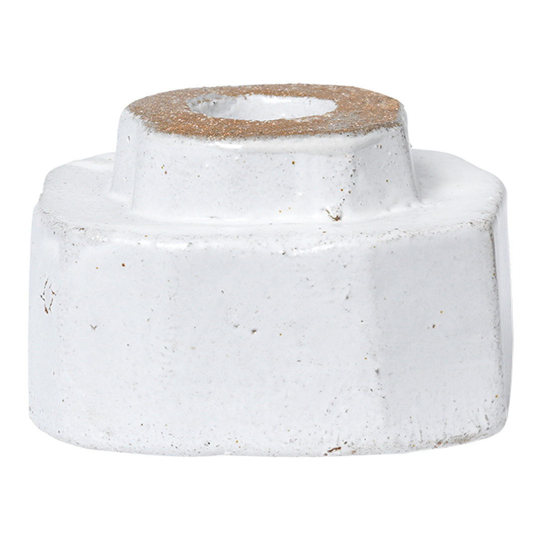 White ceramic candle holder with a natural brown rim and subtle speckled texture. Ideal for modern decor.