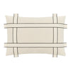 Beige pillow with black grid pattern and contrasting lines, perfect for modern decor.