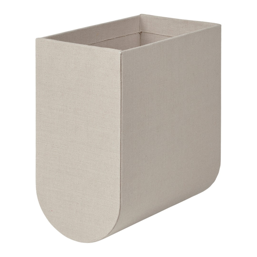 Beige rectangular storage bin with a textured finish and rounded base, perfect for organizing home spaces.