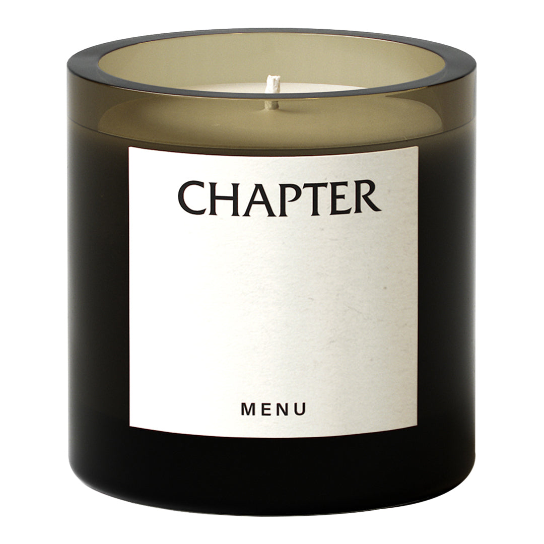 Black glass candle holder with an elegant beige label, subtle color gradient, and minimalist design.
