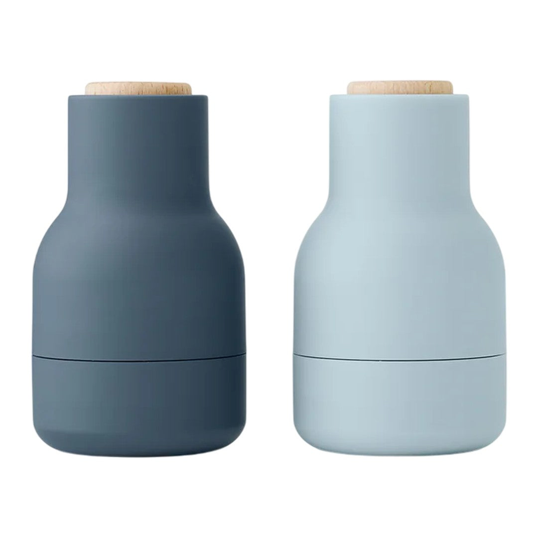 "Set of two vases in dark slate gray and soft pastel blue, featuring matte finishes and natural wood tops."