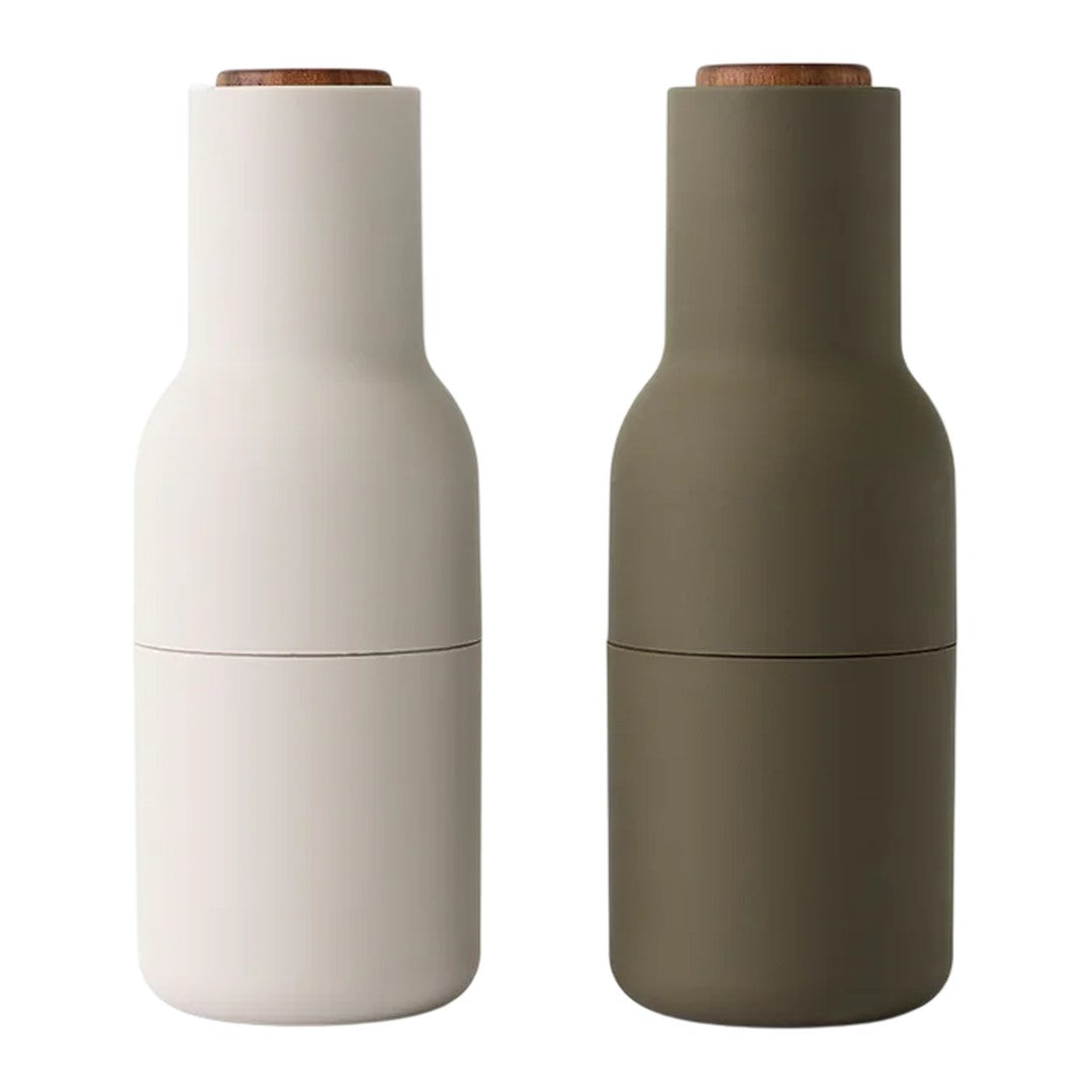 Stylish salt and pepper shakers in matte white and olive green, featuring a natural wood top. Modern minimalist design.