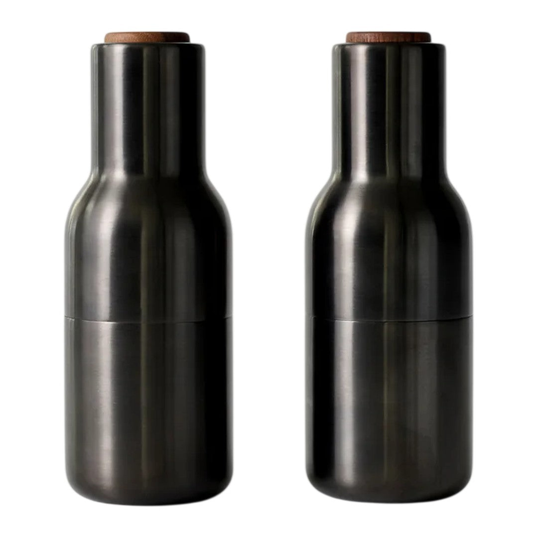 Set of two sleek black ceramic bottles with wooden tops, featuring a smooth, modern design. Ideal for décor or storage.