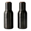 Set of two sleek black ceramic bottles with wooden tops, featuring a smooth, modern design. Ideal for décor or storage.