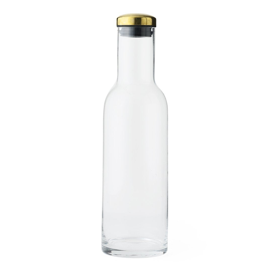 Clear glass bottle with a sleek shape, featuring a gold and silver cap for a modern touch.