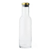 Clear glass bottle with a sleek shape, featuring a gold and silver cap for a modern touch.