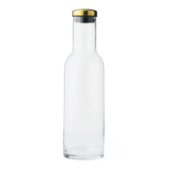 Clear glass bottle with a sleek shape, featuring a gold and silver cap for a modern touch.