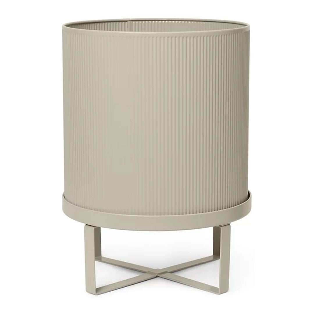 "Neutral beige planter with ribbed texture and minimalist metal stand."