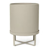 "Neutral beige planter with ribbed texture and minimalist metal stand."