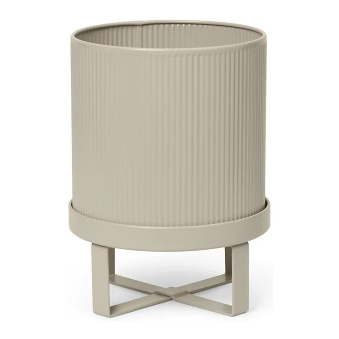 Beige ribbed planter with a stylish stand, featuring subtle texture and a modern design. Perfect for any decor.