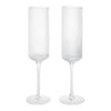 Clear ribbed glass champagne flutes with elegant tall stems, perfect for special occasions and celebrations.