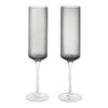 Set of two elegant gray ribbed champagne flutes with clear stems for a modern touch. Perfect for any celebration.