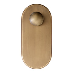 Brushed brass door knob with a smooth, round handle and oval backplate for a modern, elegant finish.