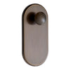 Brushed bronze oval door knob with smooth, rounded handle and subtle metallic sheen. Perfect for modern decor.