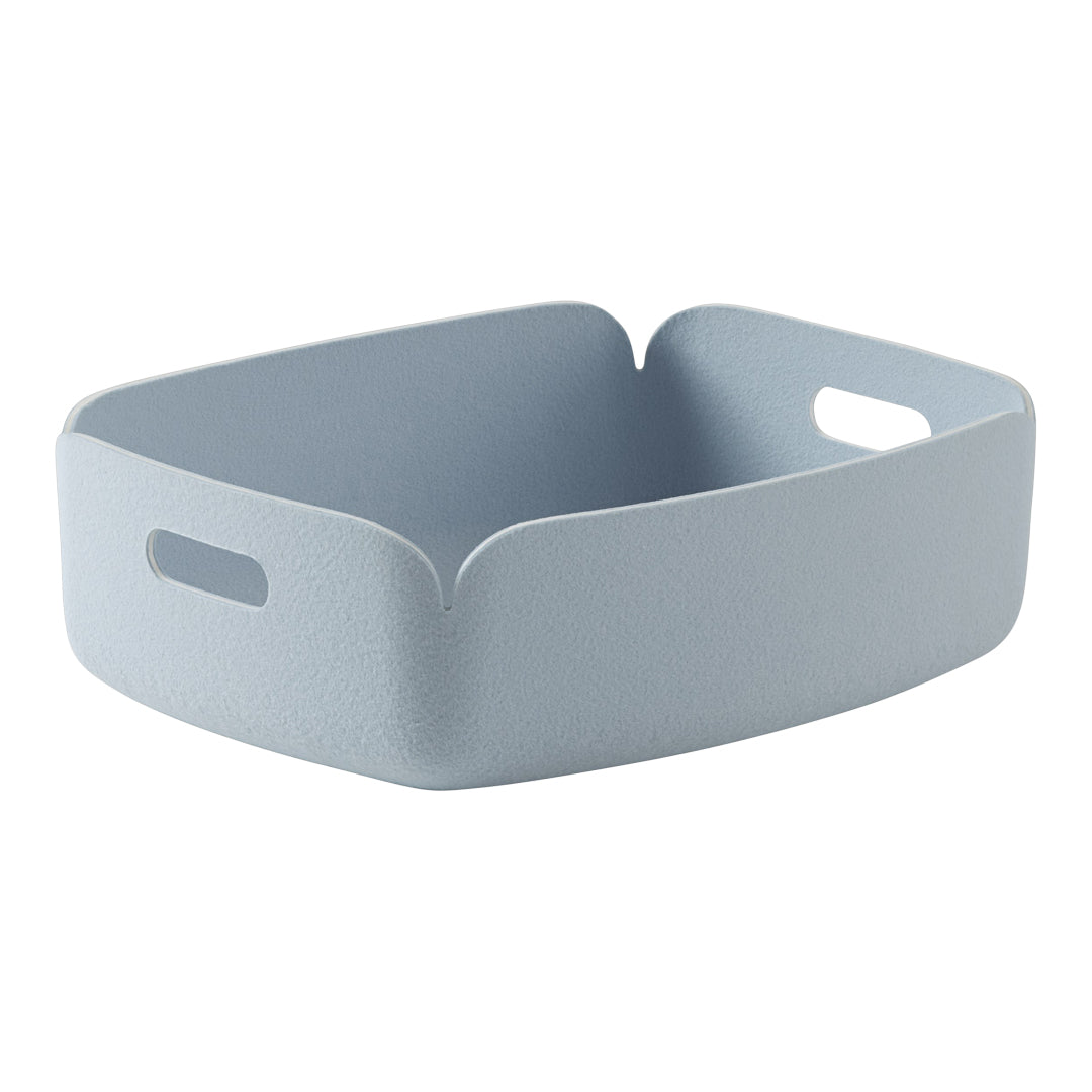 Soft blue rectangular storage basket with textured finish and cut-out handles. Ideal for organizing any space.