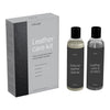 "Leather care kit with sleek black packaging and grey bottles, featuring minimalist design and modern typography."