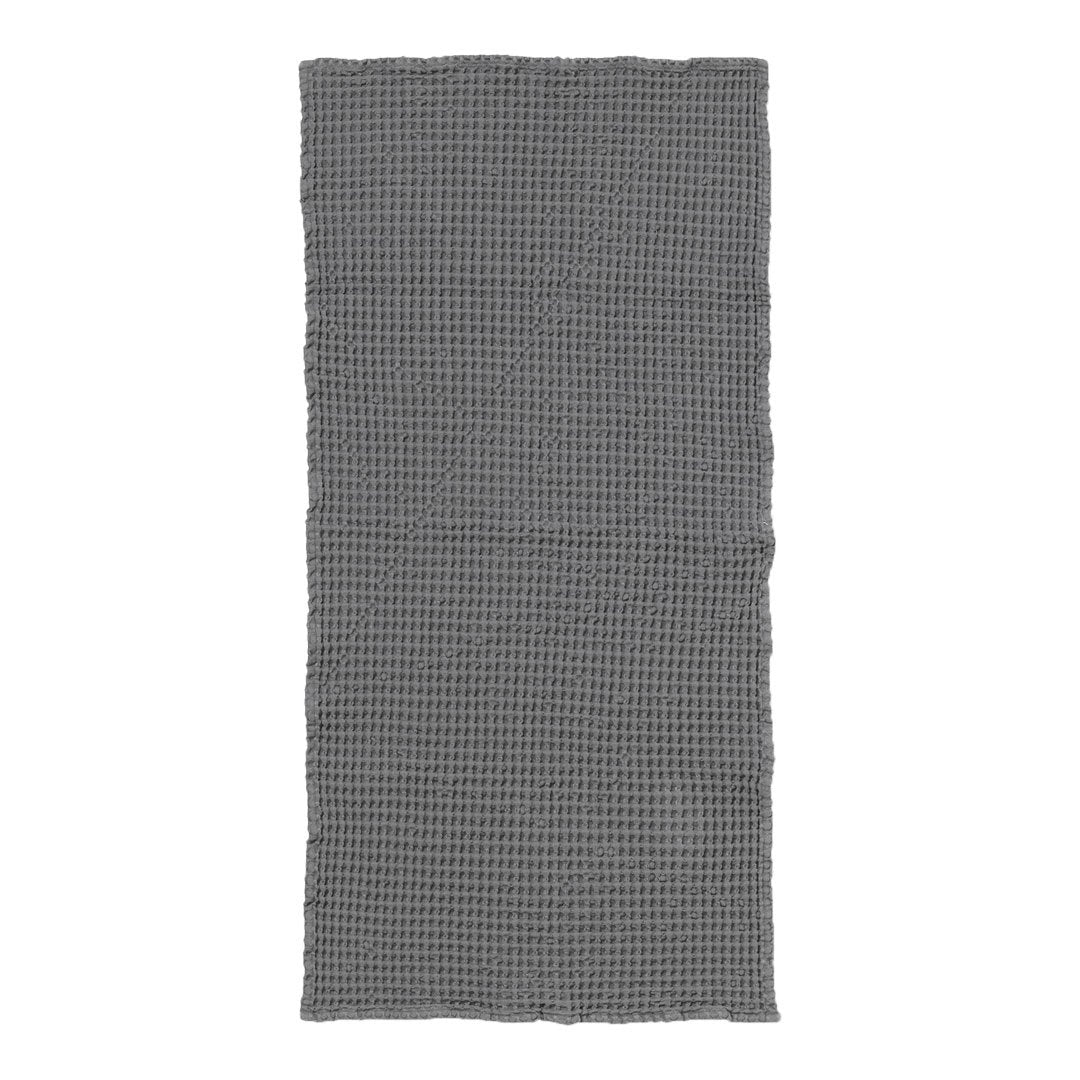 Gray and white checkered pattern textile with a textured finish, perfect for home decor or dining.