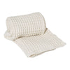 Light ivory textured blanket with a classic woven pattern, adding warmth and elegance to any space.