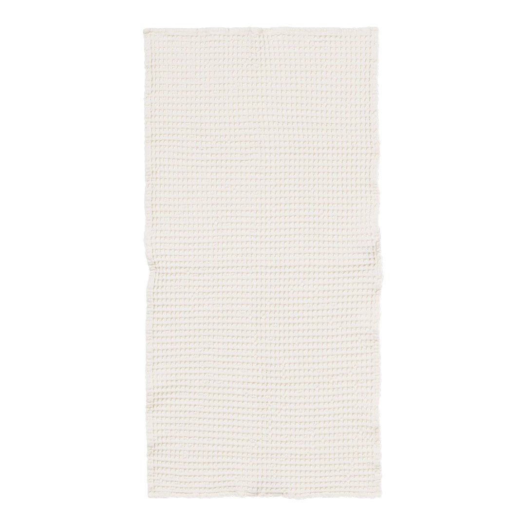Beige fabric with a subtle grid pattern in soft cream and light tan hues. Perfect for versatile home decor.