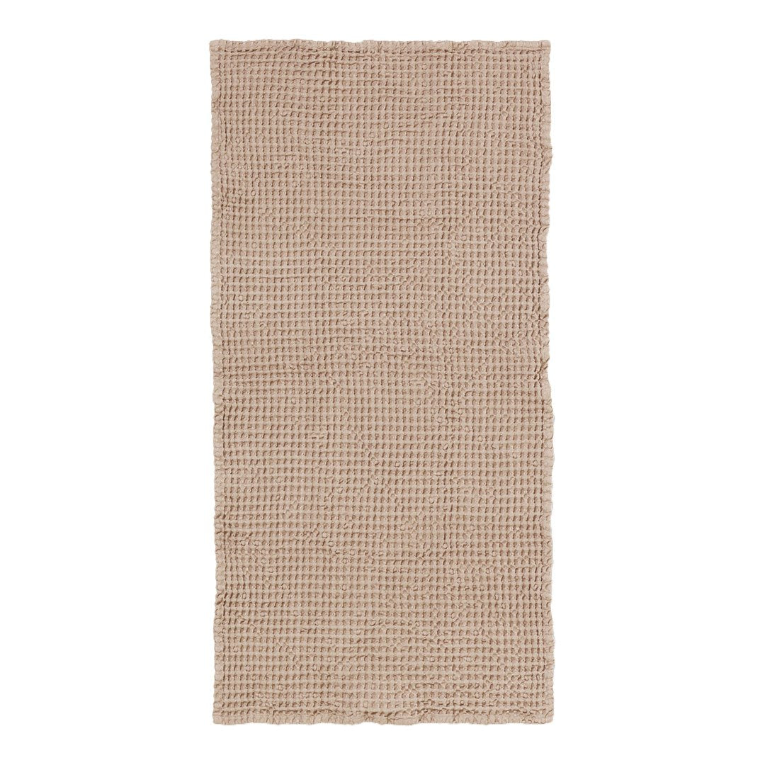 Beige woven fabric with a textured checkered pattern, perfect for home decor or upholstery.