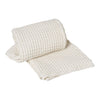 Woven cream-colored fabric roll with a textured, grid-like pattern, perfect for home decor or crafting projects.