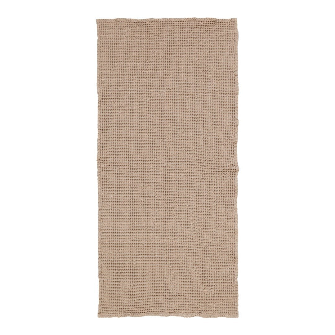 Beige textured fabric with subtle checked pattern, perfect for home decor and textile projects.