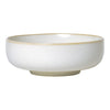 White ceramic bowl with a subtle speckled pattern and a chic gold rim. Perfect for elegant dining.