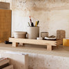 Natural wood tray with a minimalist design, featuring soft neutral tones and subtle textures. Perfect for organization.