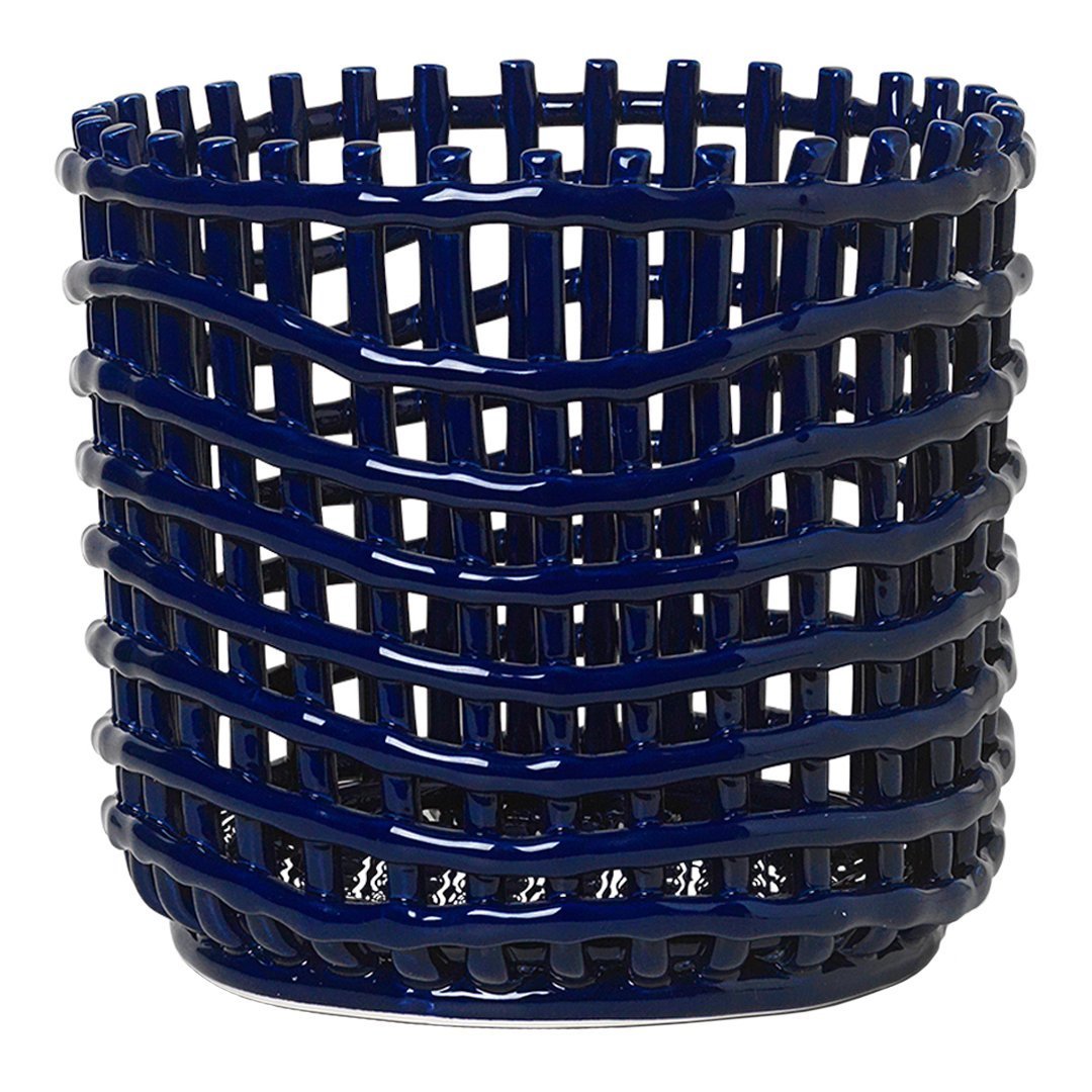 Navy blue woven basket with a distinctive wave pattern, perfect for home decor and organization.