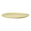 Light yellow, smooth, round serving plate with a simple, minimalist design and subtle variations in texture.