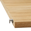 Light oak wooden shelf edge with a smooth grain pattern and silver metal bracket. Ideal for modern decor.