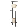 Black metal toilet paper holder with cream rolls, featuring a minimalist design and modern aesthetic.