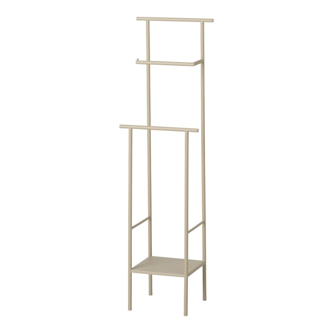 Beige metal standing shelf with a minimalist design, featuring three open shelves and a bottom storage area.