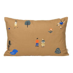 Brown decorative pillow featuring playful patterns of trees, people, and flowers in blue and orange hues.