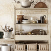 "Beige shelving unit adorned with glass jars, woven baskets, and assorted ceramic and metal kitchenware."