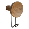 Round wooden wall hook in warm brown finish with a sleek black metal base, featuring a natural wood grain pattern.