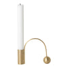 White candle in a gold holder featuring a sleek modern design with curved lines and a spherical accent.