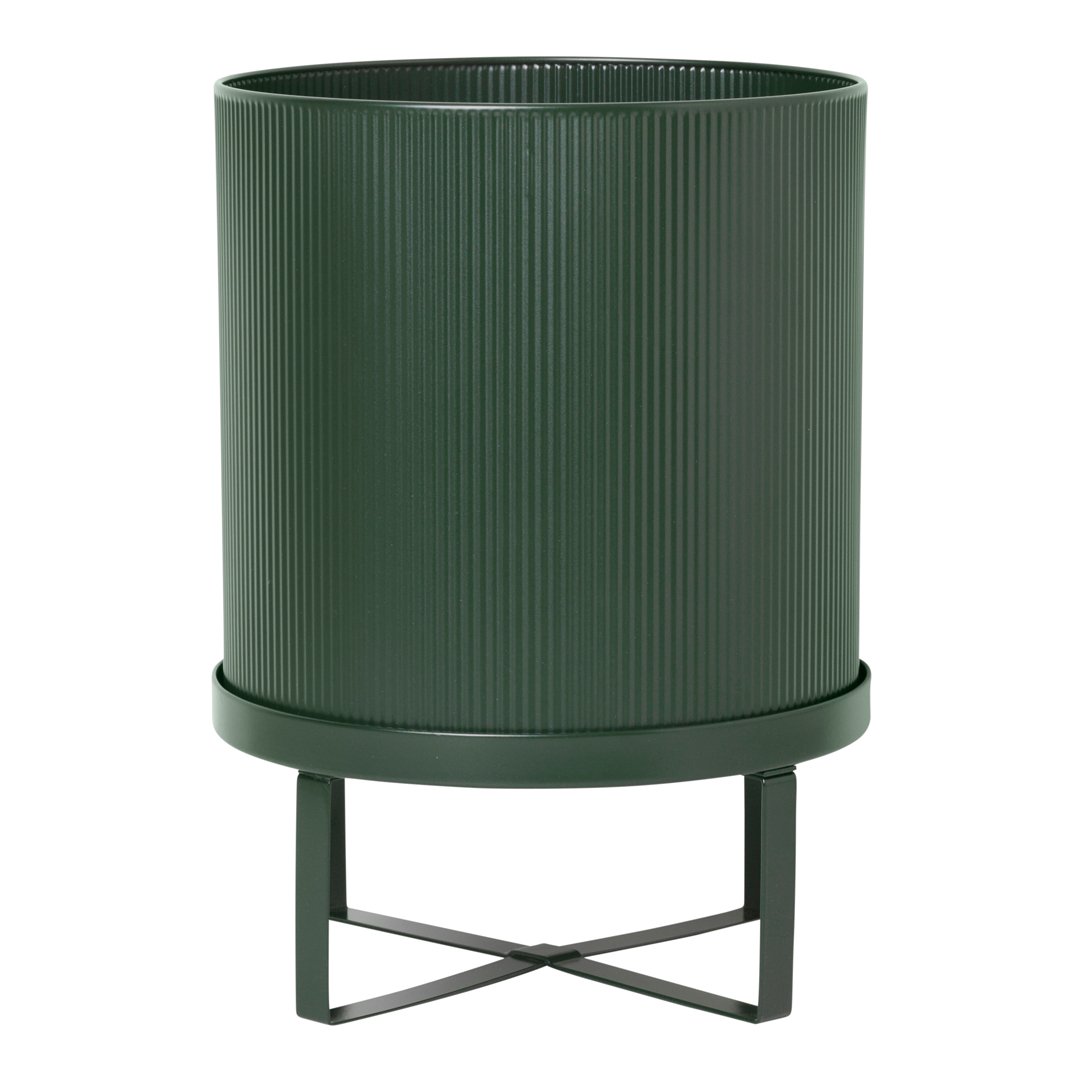 Green ribbed planter with sleek metal stand, perfect for adding a modern touch to any decor.