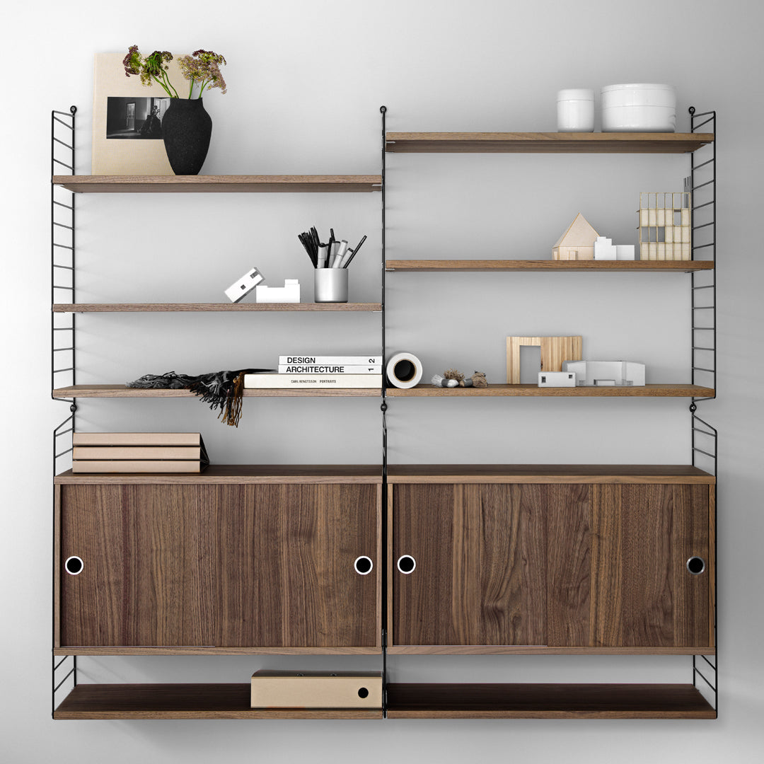 Modern shelving unit with warm wood tones, sleek black metal accents, and a minimalist design. Perfect for stylish storage.