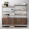 Modern shelving unit with warm wood tones, sleek black metal accents, and a minimalist design. Perfect for stylish storage.