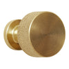 Brushed brass knob with a textured, circular pattern and smooth finish. Ideal for modern home decor.