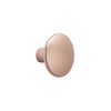 Sleek round drawer knob in soft rose gold finish, smooth surface with a contemporary matte texture.