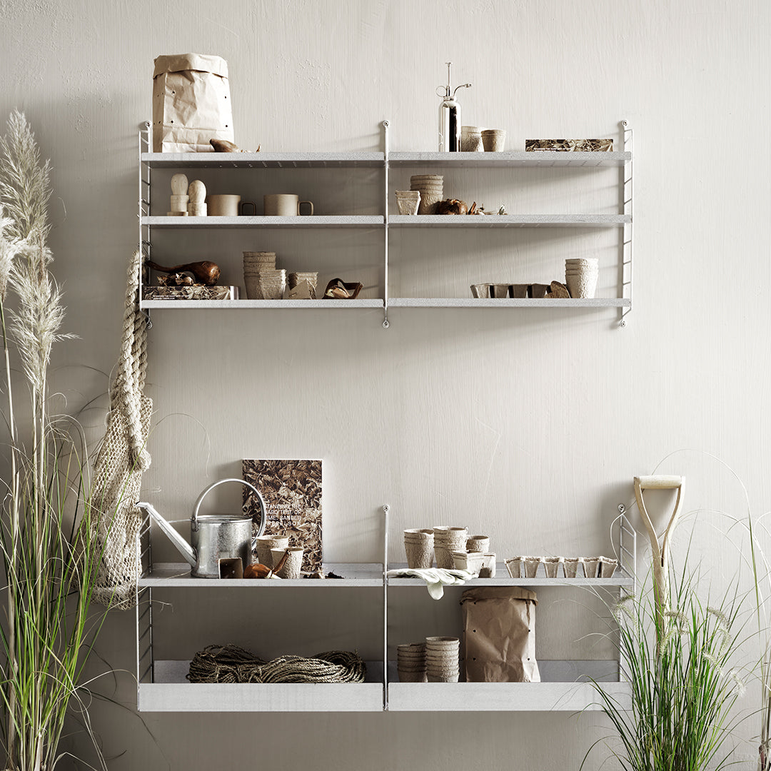 "Minimalist white shelving with natural wood and earthy tones, showcasing a blend of textures and organic decor."