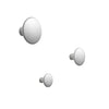 Three sleek, round wall hooks in a glossy white finish, showcasing a clean and minimalist design.