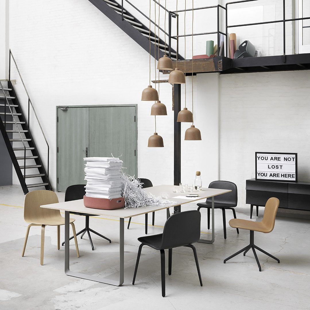 Modern dining space featuring beige, black, and natural wood tones with minimalist design and soft textures.