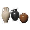 Three vases in cream, black, and brown hues; featuring smooth finishes and rounded shapes, perfect for home decor.
