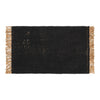 Black woven rug with beige fringes, featuring a textured pattern for a stylish, modern look.